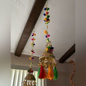Colorful Indian decorations. Pom pom, parrot, and pearl accents!